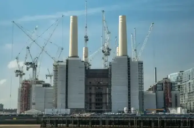 The Battersea Power Station in the UK during its redevelopment, surrounded by construction cranes.